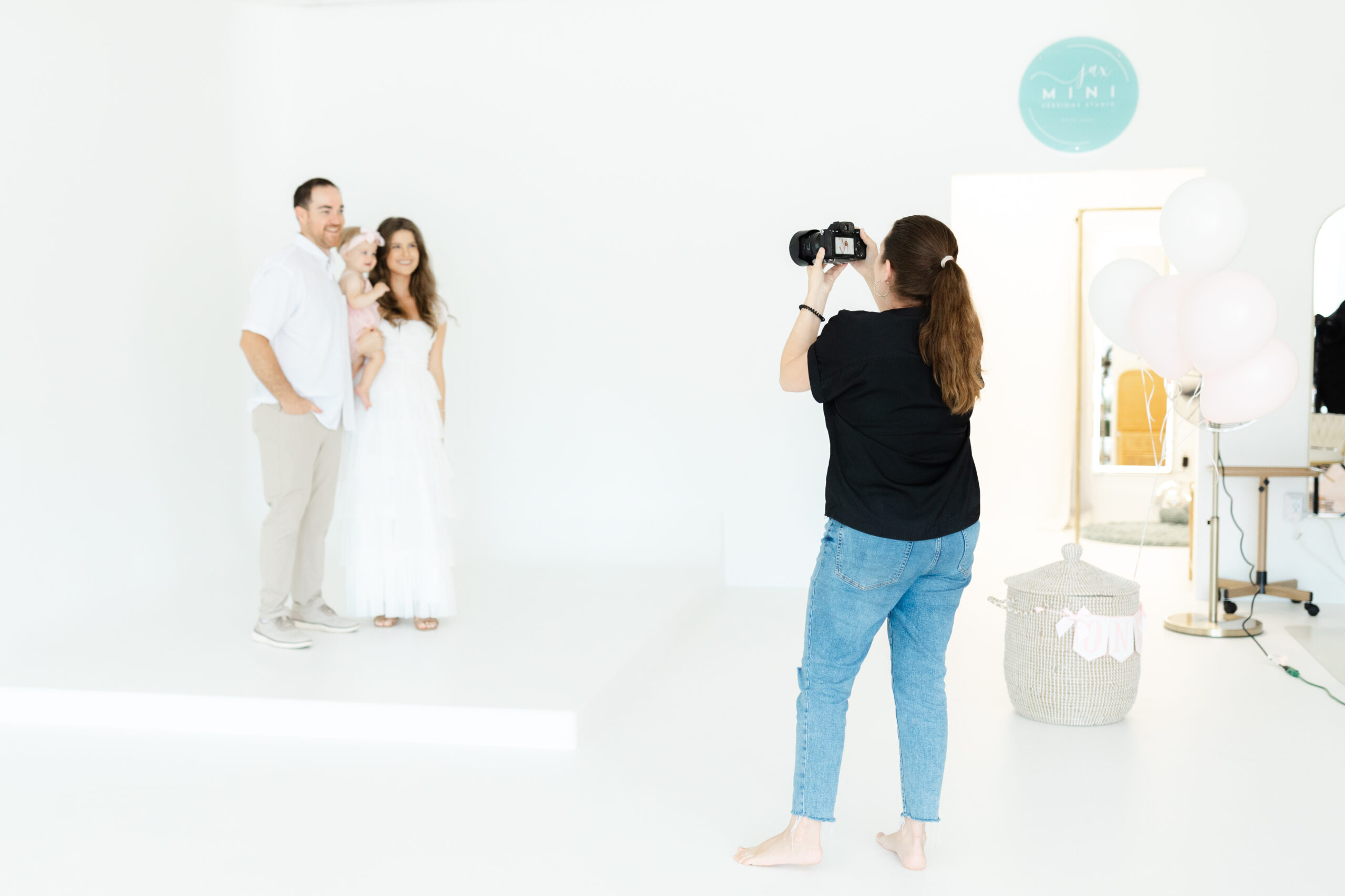 Nikki Golden Photography capturing a family photo session at Jax Mini Sessions Studio