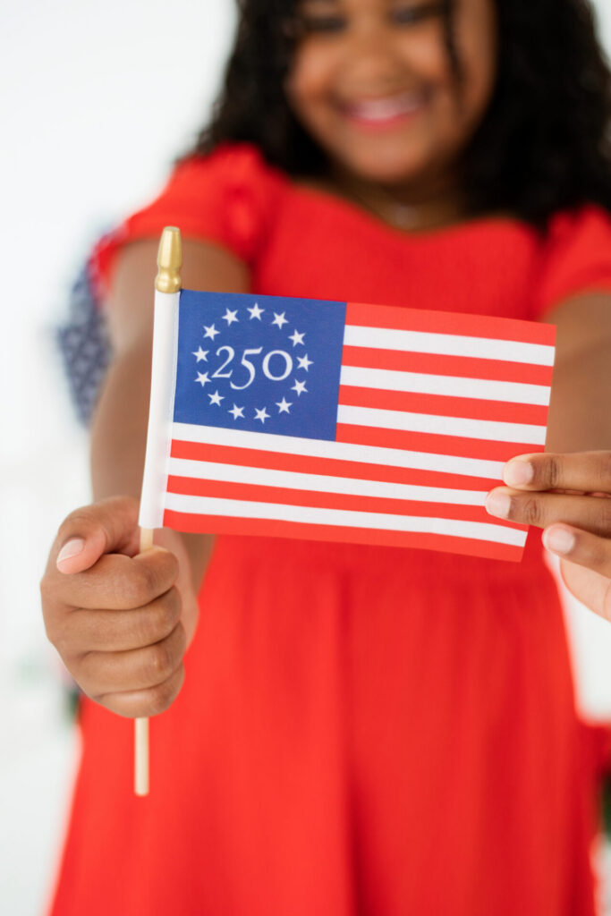 Patriotic portrait session celebrating 250 years of America with American flag in Jacksonville, FL.