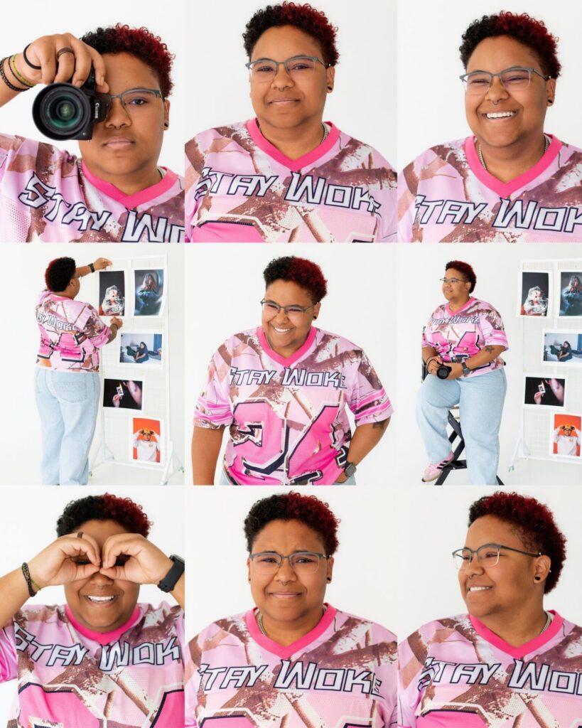 Jacksonville University graduate personality portrait session featuring senior posing with camera to showcase photography hobby in studio setting.