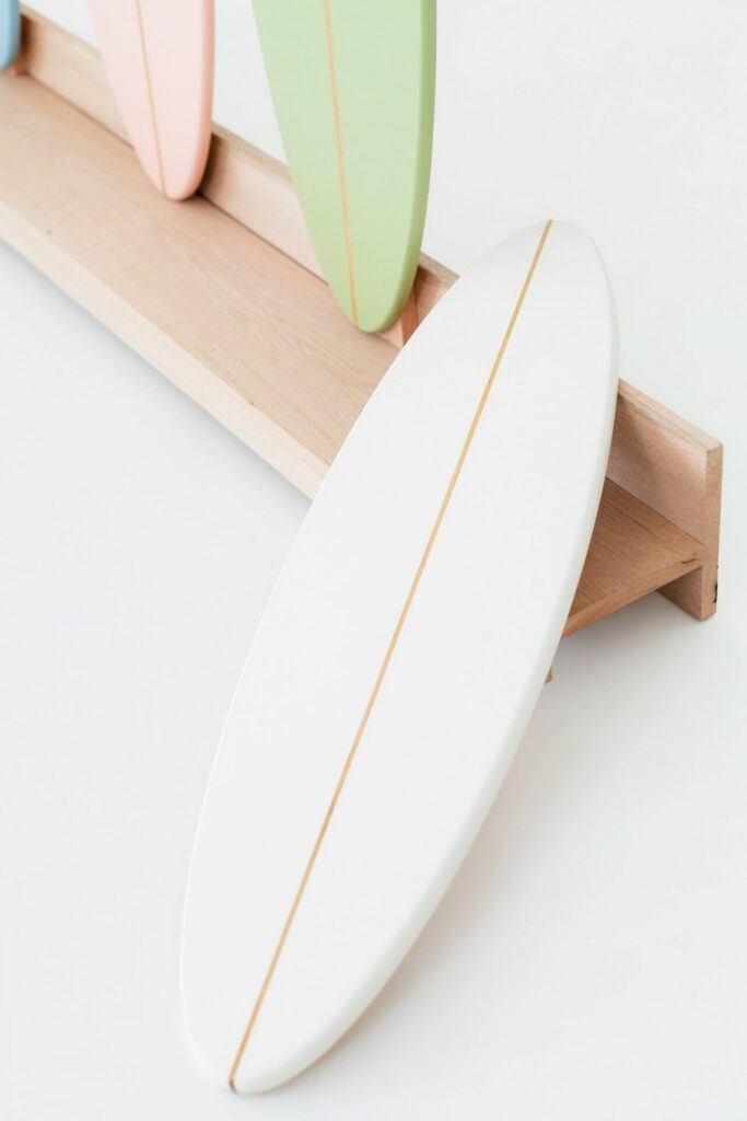 Interactive white surfboard featured in summer beach photo studio installation at Jacksonville natural light studio.