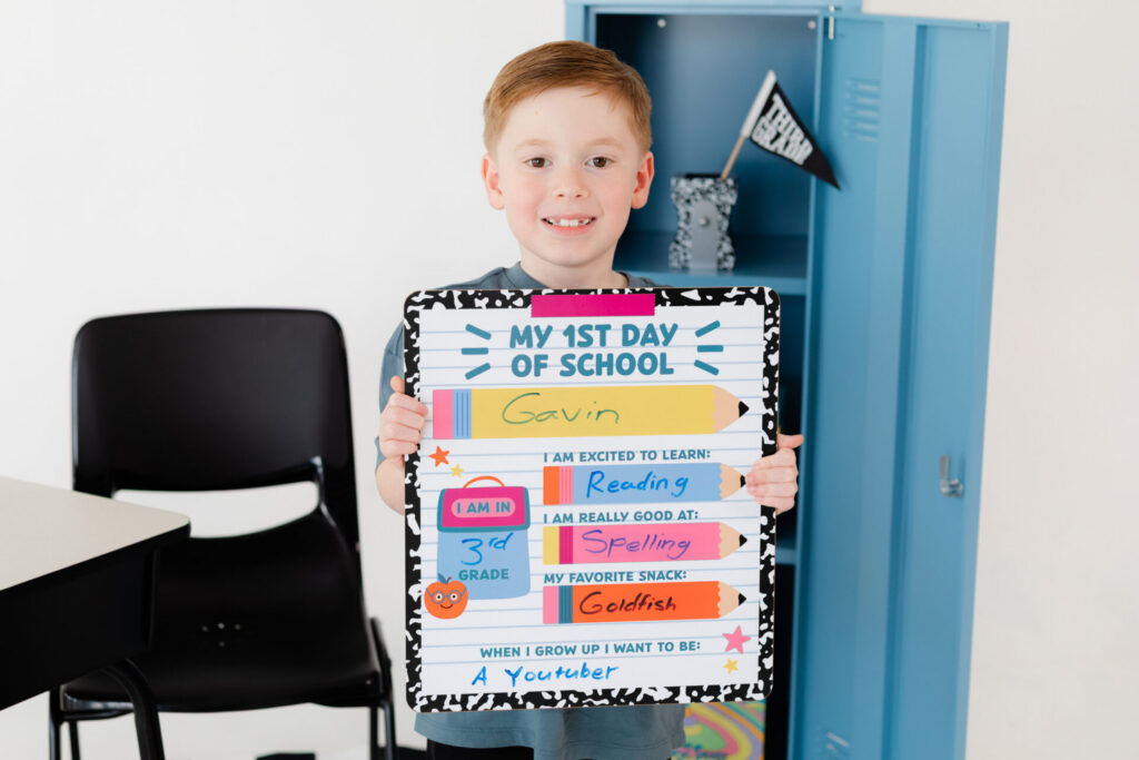 Third grade boy posing for his 1st day of school photos captured in a Jacksonville Florida photo studio